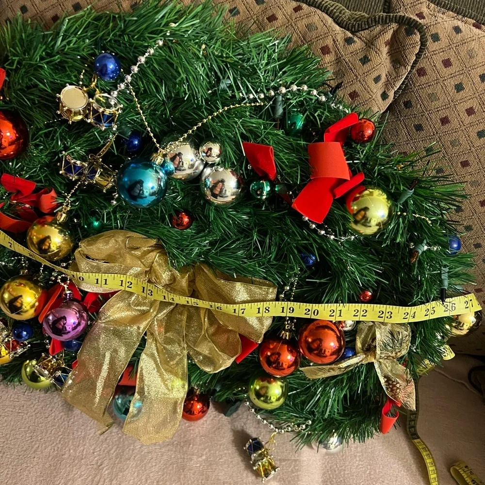 Festive Holiday Wreath with Gold Bow and Multicolor Ornaments
